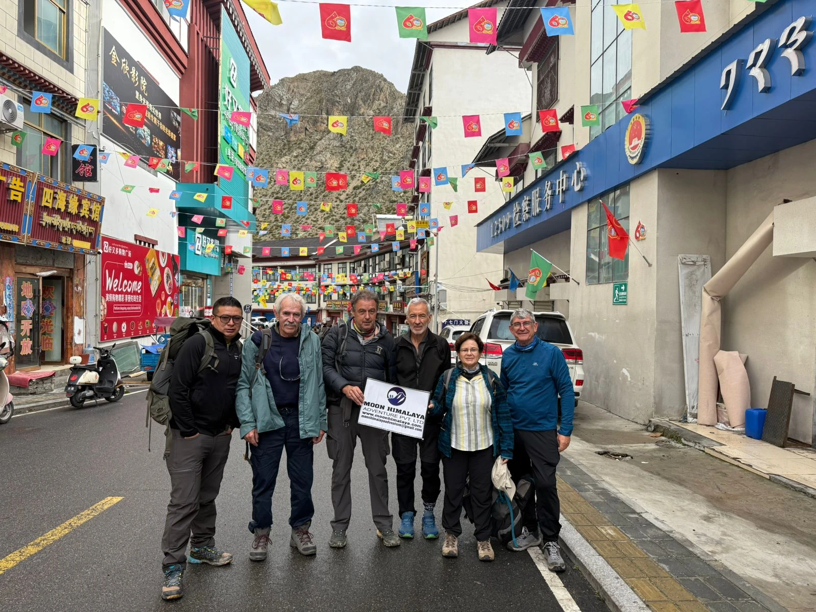 Group of trekkers in a Tibetan town on the Lhasa to Mount Kailash overland route